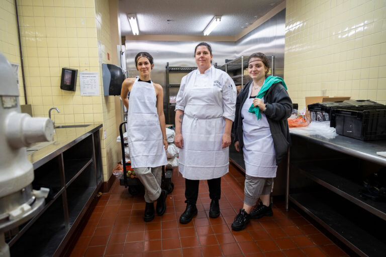 Chef Trish and volunteer students prepare meals for the holidays at U of T