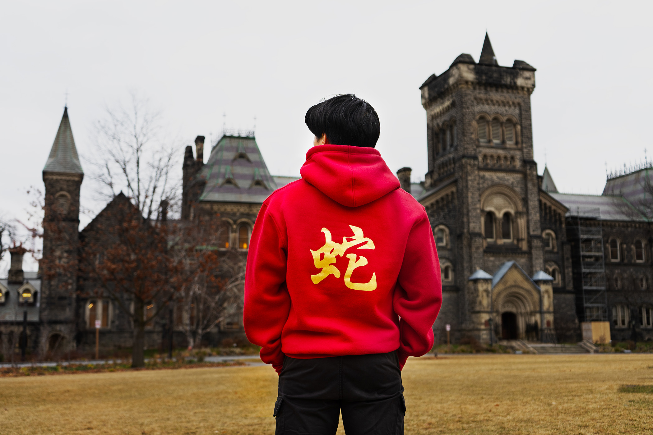 Student wearing the LNY Snake Crewneck at King's College Circle